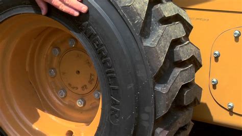 how to change flat tire on a skid steer|skid loader tire repair without jack.